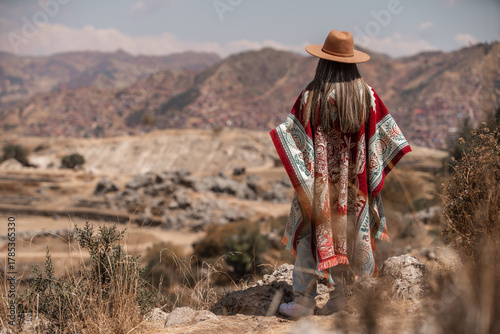 Woman walking in Saqsayhuaman Cusco Peru