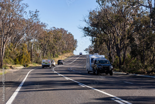 Wallpaper Mural car towing caravan and vehicles traveling along New England Highway road in rural Australia Torontodigital.ca