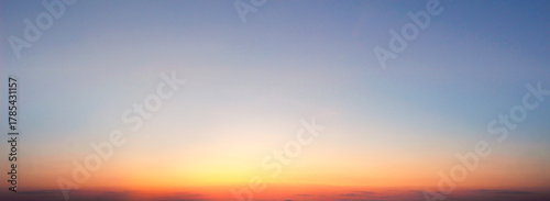 Sunset sky background. Panoramic view of sunset sky.