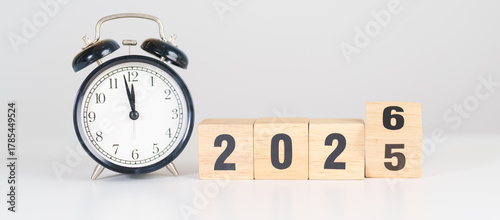 2025 end year to Happy New Year 2026 with vintage alarm clock. Christmas, New Start, Resolution, countdown, Goals, Plan, Action and Motivation Concept