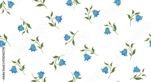 Seamless pattern with delicate blue bellflowers and green leaves scattered on a pristine white background, perfect for textiles or wallpaper.