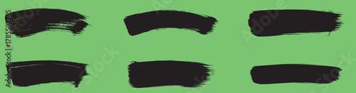 Collection of six black brush strokes on a green background, ideal for adding a touch of artistic expression to your projects, creating unique textures, or highlighting specific areas
