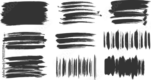 Collection of nine dark grey abstract brush stroke textures and artistic paint splatters on white background