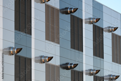Принти на полотні Close-up view of exterior exhaust vents and louvered panels on a modern data cen