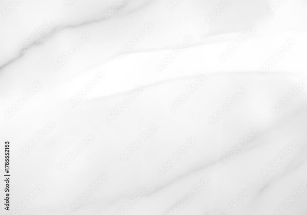 Fototapeta premium Elegant white marble texture with subtle gray veining, featuring a smooth reflective surface and a bright light highlight