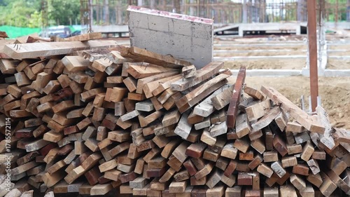 Stacked wooden planks and rough timber construction site, brown building material and outdoor stack, showcasing natural wood texture and industrial preparation for building with timber and plank