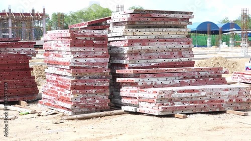Stacked Metal Formwork Panel Construction Site Outdoor Industrial Steel Red Equipment Building Foundation Preparation Structure Material Development Organized Engineering Weathered Concrete Structure