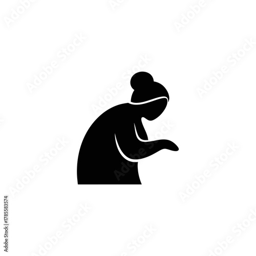 Silhouette of a person with their head bowed, possibly in a gesture of contemplation or work.