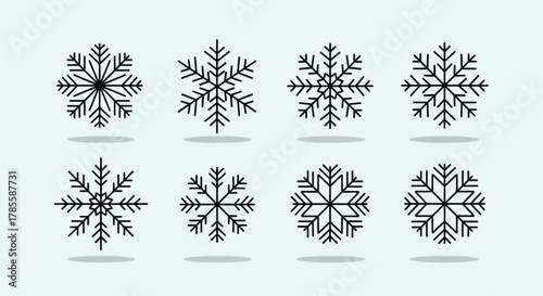 Collection of eight distinct black snowflake icons with intricate crystalline designs.