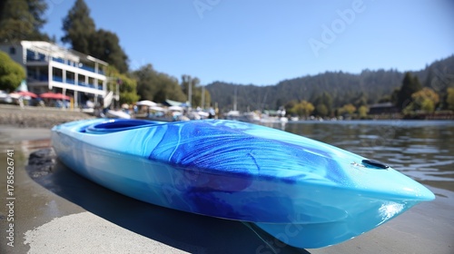 kayak. A kayak rests on the shoreline, reflecting calm blue waters in a serene natural setting. tourism brochures, itinerary planners, designed for travel destination branding.