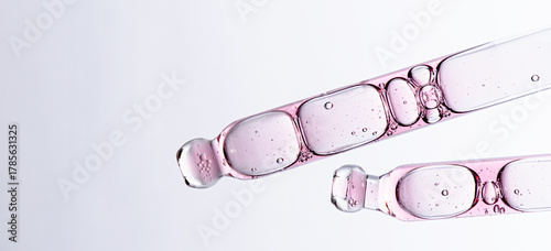 Skin serum in a pipette. A cosmetic product for body care. White background. Copy space