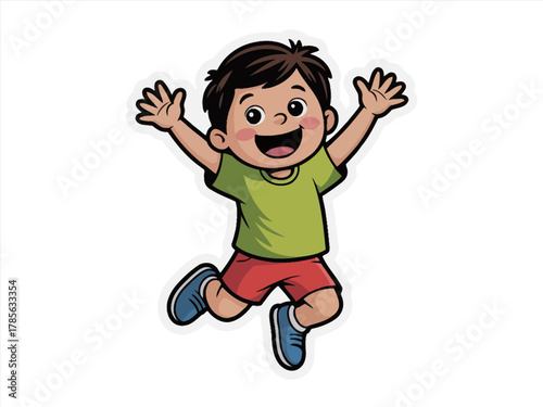 A happy young boy jumps for joy with his arms in the air.