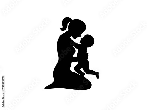 Silhouette of a mother tenderly holding her baby close.