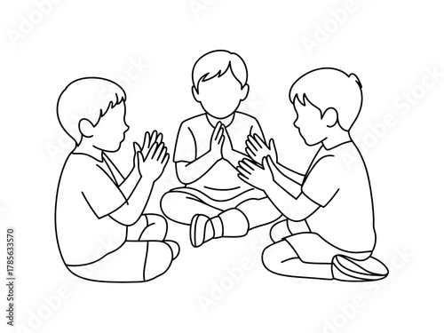 Three children are sitting in a circle playing a clapping game together.