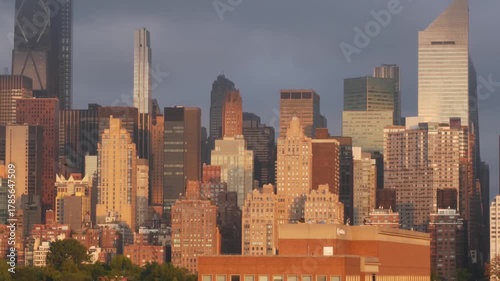New York City Manhattan Midtown skyline from Queens, United States. Skyscraper buildings architecture, cityscape from rooftop in Long Island, Hunters Point. Early morning sunrise golden hour sun light