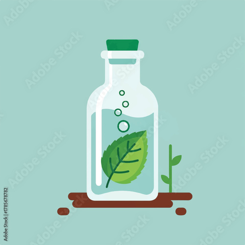 A bottle with a leaf and bubbles sits on a brown surface next to a small plant