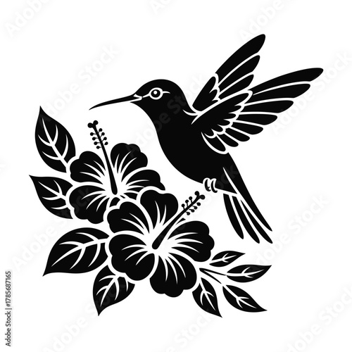 Black silhouette of a hummingbird hovering near hibiscus flowers