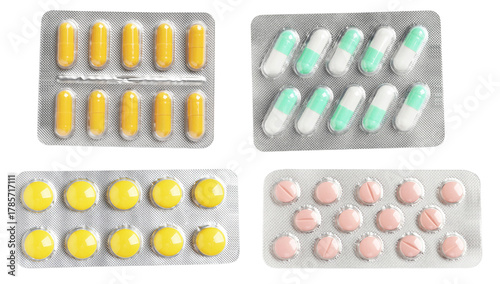 Fotografía assortment of four different aluminum blister packs containing various pharmaceutical medications, including capsules and round tablets of different colors, isolated on black