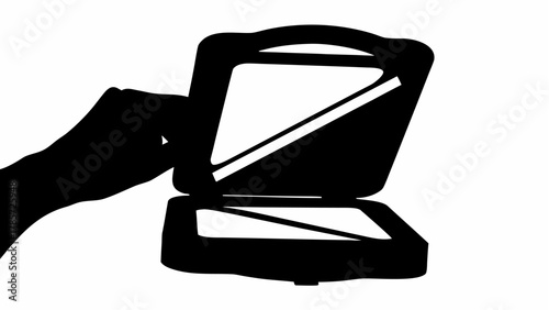 A silhouette of a hand reaching towards an open scanner with a white interior and black exterior frame