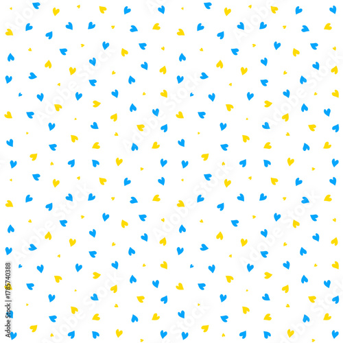 Cute seamless pattern with small blue and yellow hearts. Playful random scattered hearts in Ukrainian flag colors. Perfect for gift wrapping, packaging, kids fabrics or Ukrainian projects. Vector