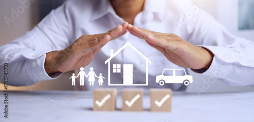 insurance concept with man in white using two hand to protect the family represent to coverage benefit of life insurances for example house, car and healthy for everyone