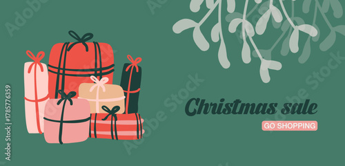 Décorations de Noël et cadeaux sur fond vert, avec branche de gui. Cadre et bannière de Noël pour le thème des fêtes de fin d'année. Illustrations vectorielles