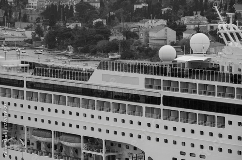 Italian family cruiseship cruise ship liner Lirica, Armonia or Sinfonia in port of Dubrovnik, Croatia during Summer Mediterranean cruising with harbor infrastructure marine traffic