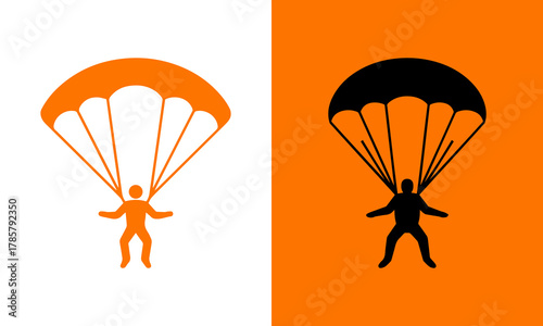 Silhouette of a skydiver descending with an open parachute against a split background