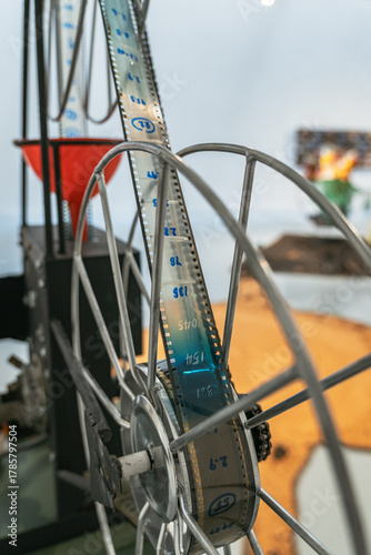Close-up of a film projector reel with filmstrip