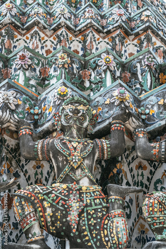Wat Arun temple spire with intricate porcelain decoration in Bangkok, Thailand
