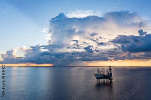 Obraz na plátně Offshore jack up rig in aerial view in the middle of the ocean taken by a drone