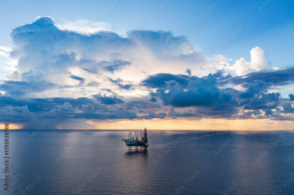 Obraz premium Offshore jack up rig in aerial view in the middle of the ocean taken by a drone