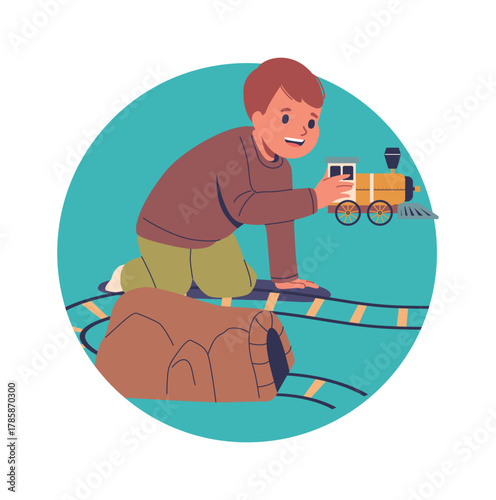 Preschool boy playing railroad game