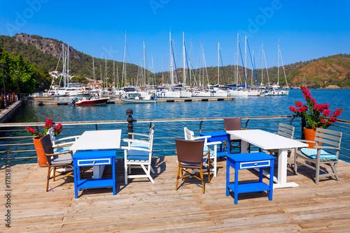 Fototapeta Naklejka Na Ścianę i Meble -  Greek style street cafe at the Fethiye port, Turkey