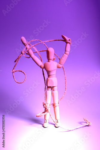 Wooden puppet with strings. Concept of emotional manipulation,dictatorship and control