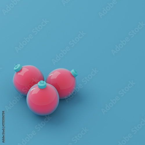 Three red chrismas baubles on bright blue background in pastel colors