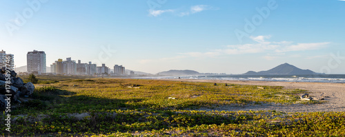 Panoramic view of the beach in the city of Navegantes on a sunny day, Santa Catarina, Brazil.