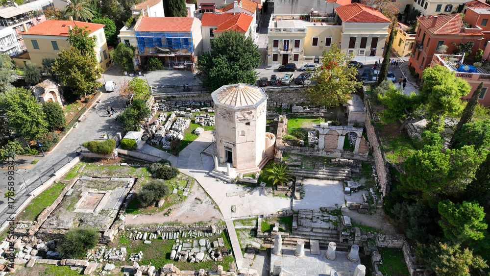 Fototapeta premium Aerial drone photo of iconic Roman Market featuring tower of Winds and Gate of Athena in the heart of Athens historic centre built in Plaka district, below Acropolis hill, Attica, Greece