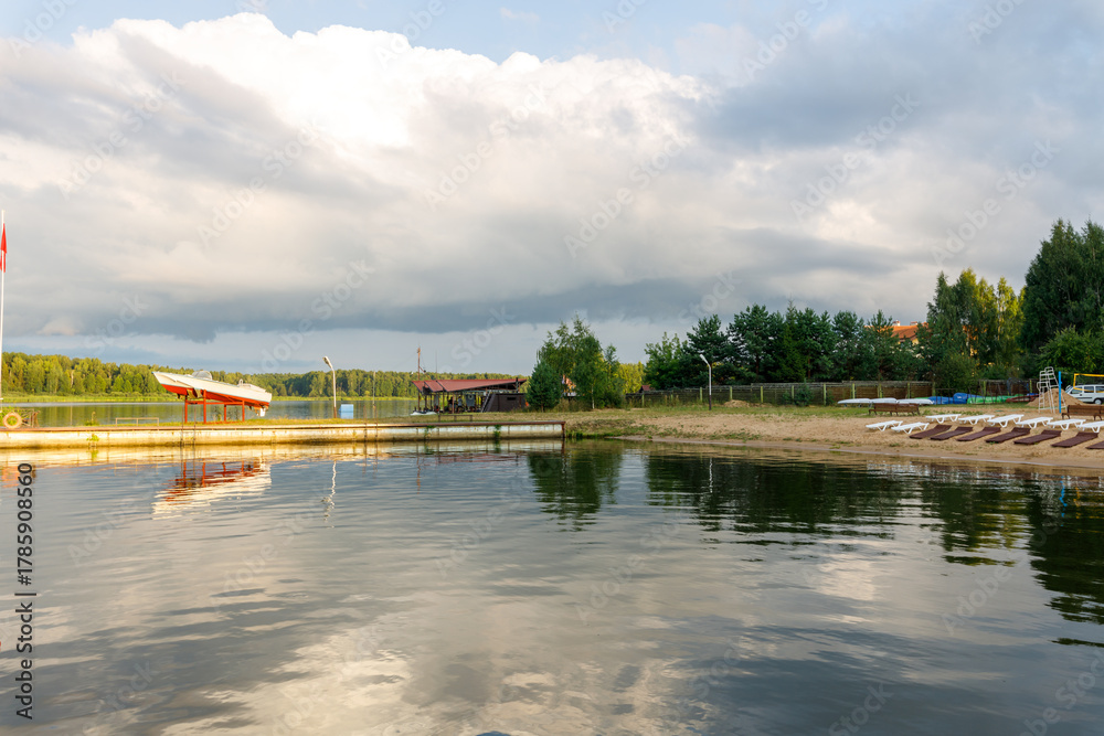 Fototapeta premium Lake with a dock and a few boats