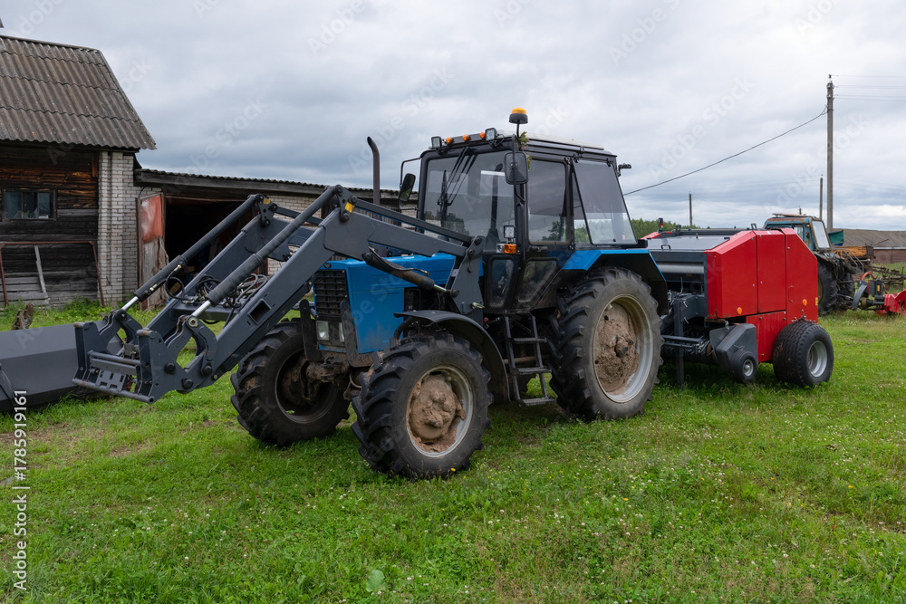 Fototapeta premium Heavy agricultural machinery in the parking lot awaiting repairs and maintenanceHeavy agricultural machinery in the parking lot awaiting repairs and maintenance