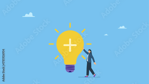 Cheerful businesswoman standing with bright lightbulb idea with positive sign. Positive thinking, optimistic bring success to work and living, inspiration and happiness in work.