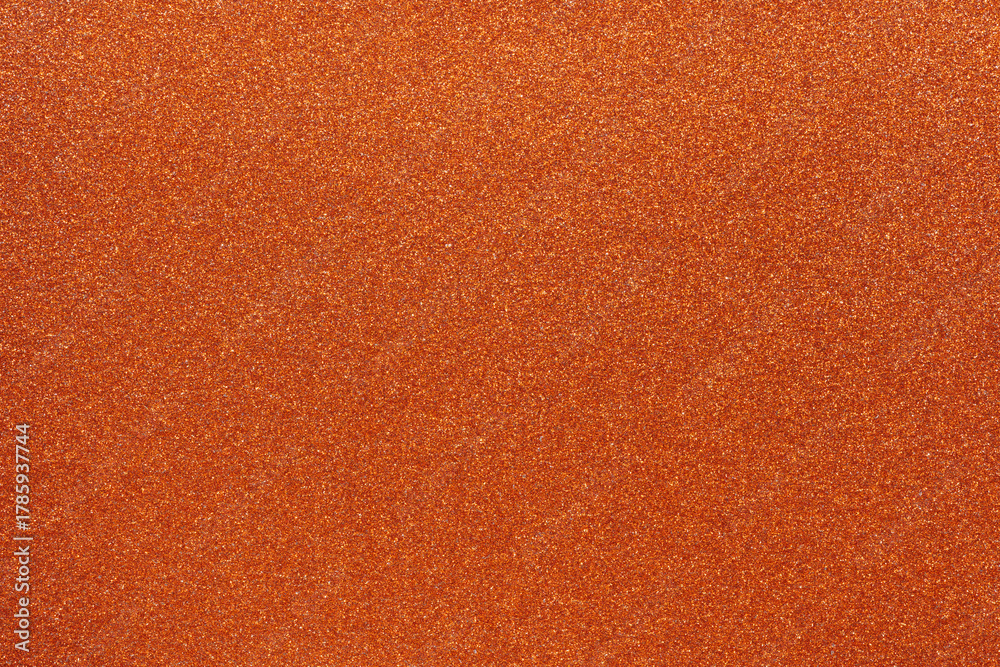Fototapeta premium Colorful orange glitter background for holiday design textures