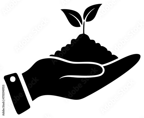 Hand holding soil with a young plant sprouting up, conceptual representation of growth and care