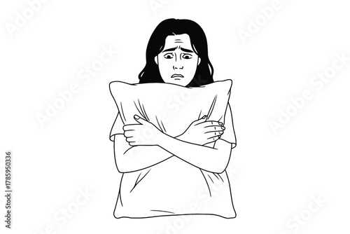 A person hugs a pillow tightly, displaying signs of fear and anxiety.