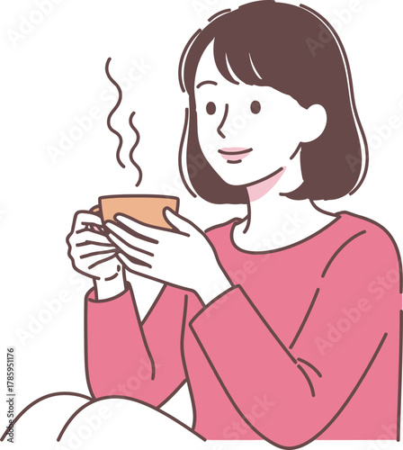 A serene woman enjoys a warm beverage, creating a moment of relaxation and comfort, perfect for a peaceful break