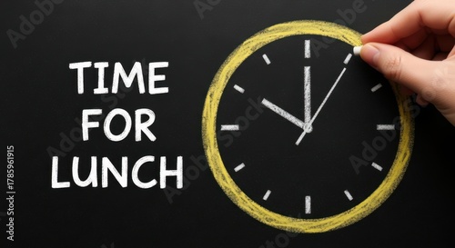 Hand adjusts clock hands indicating it is time for lunch break