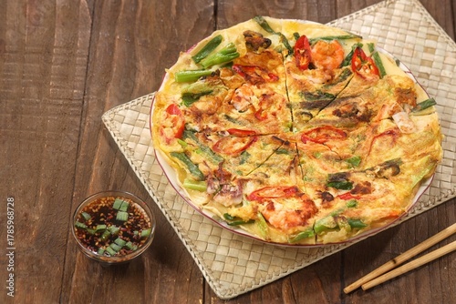 Pajeon is a typical Korean savory pancake made from flour dough, spring onions, and various seafood.