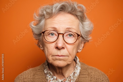 Elderly woman with curly gr...