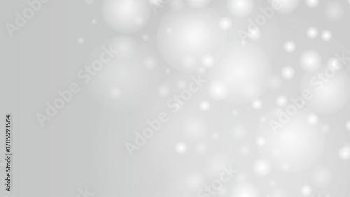 光の粒がきらめきながら漂う幻想的で優雅な抽象背景イメージ