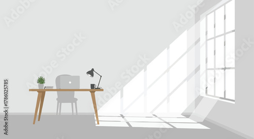 Minimalist home office desk with laptop and lamp bathed in bright sunlight streaming through a large window